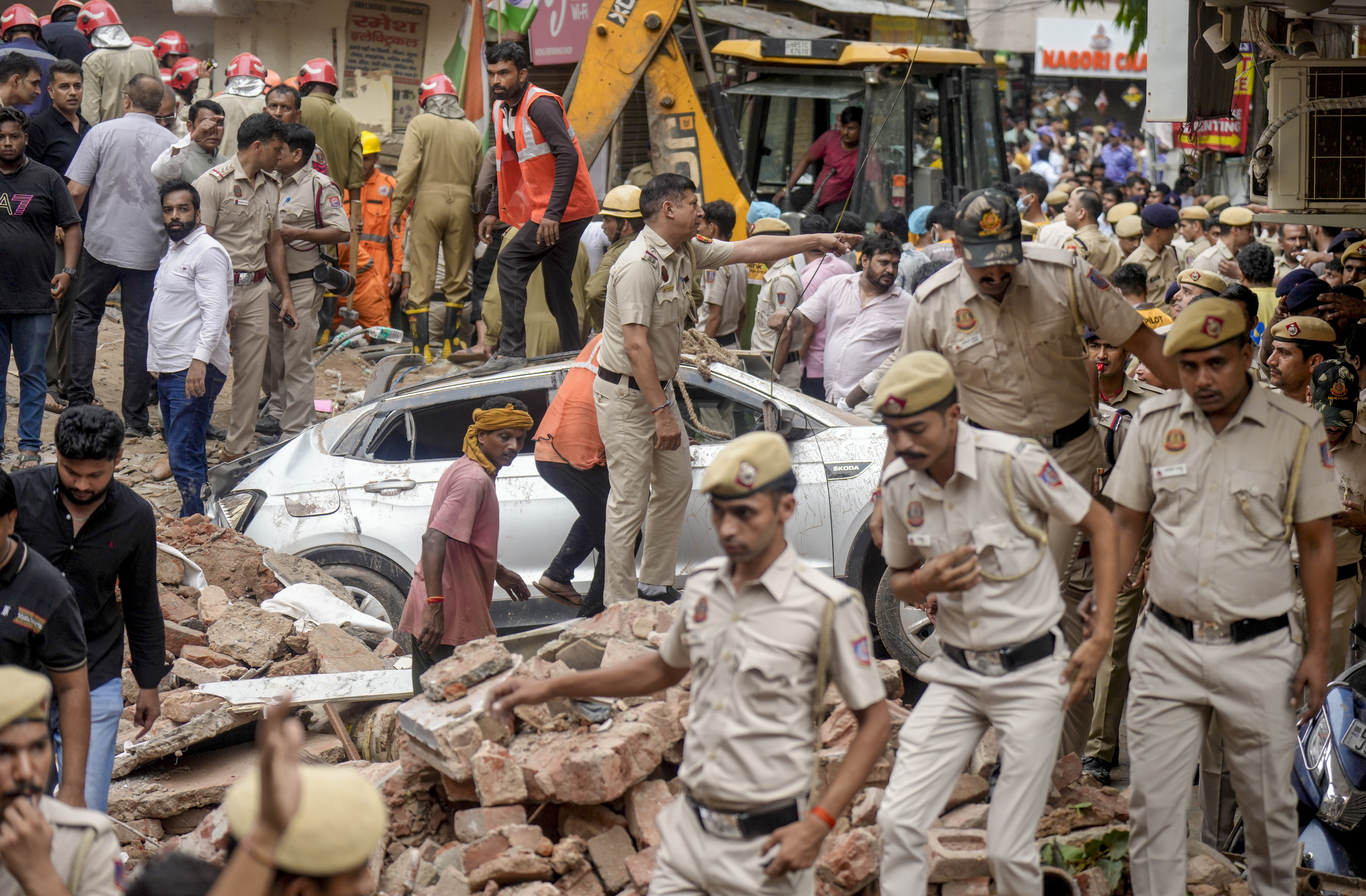 New Delhi: Police personnel on site after a five-storey building collapsed at Satya Niketan area, in New Delhi, Sunday, Sept. 6, 2026. (PTI Photo/Shahbaz Khan)(PTI09_06_2026_000154A)